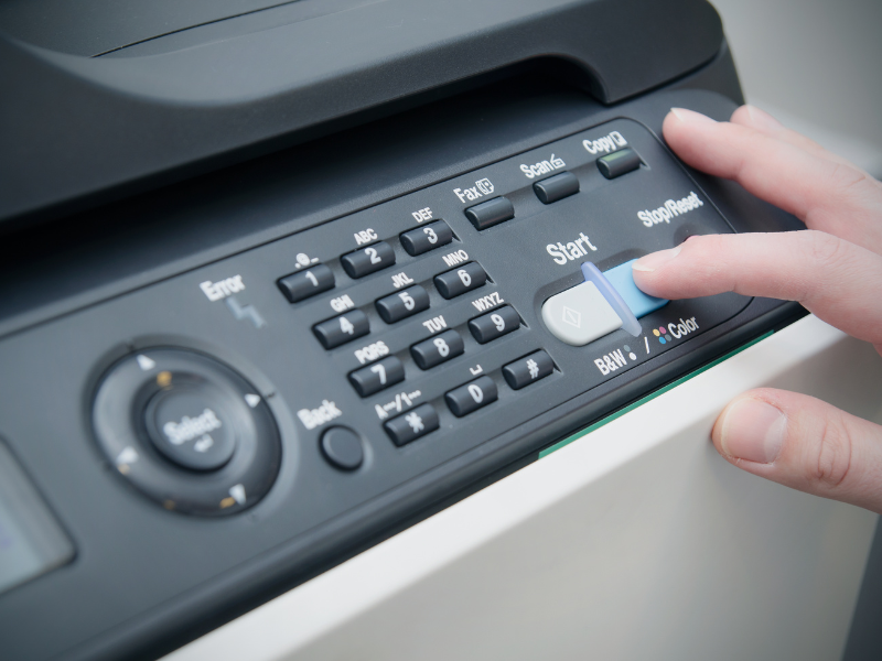 person operating a copier machine